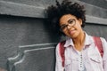 Closeup portrait of young african american student female wearing eyeglasses, getting ready to go to college. Happy young african Royalty Free Stock Photo