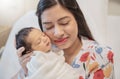 Closeup portrait of young asian Indian mother holding newborn baby with copy space. Royalty Free Stock Photo