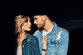 Closeup portrait of young and beautiful couple wearing denim jeans Royalty Free Stock Photo