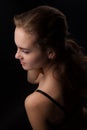 Portrait of a young, athletic and sexy woman in black underwear on a black background Royalty Free Stock Photo