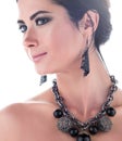 Closeup portrait of young beautiful woman with necklace and earrings Royalty Free Stock Photo