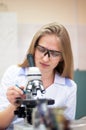 Closeup portrait young beauty blondi girl in lab