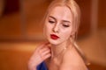 Closeup portrait of a young blonde girl. Very shallow depth of field. Sensuality, femininity, female beauty