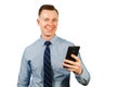 Closeup portrait of young businessman dressed in blue shirt and tie, talking on the mobile phone, isolated on white background Royalty Free Stock Photo