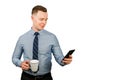 Closeup portrait of young businessman dressed in blue shirt and tie, talking on the mobile phone, isolated on white background Royalty Free Stock Photo