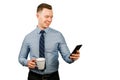 Closeup portrait of young businessman dressed in blue shirt and tie, talking on the mobile phone, isolated on white background Royalty Free Stock Photo