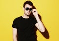 closeup portrait of a young casual man wearing sunglasses on ye Royalty Free Stock Photo