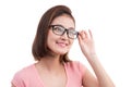 Closeup portrait of a young cheerful asian woman in glasses Royalty Free Stock Photo