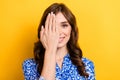 Closeup portrait of young cheerful positive brown curly hair lady wear blue shirt hide eye palm vision checkup isolated