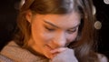 Closeup portrait of young cute caucasian brunette female smiling and imagining something with shyness Royalty Free Stock Photo