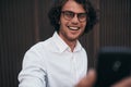 Closeup portrait of young handsome businessman taking self portrait with his smart phone outdoors. Happy smiling male wearing Royalty Free Stock Photo