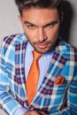 Closeup portrait of a young man in checkered suit