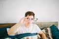 Closeup portrait of young man with glasses. He has eyesight problems and is squinting his eyes a little bit. Handsome Royalty Free Stock Photo