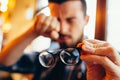 Closeup portrait of young man with glasses, who has eyesight problems Royalty Free Stock Photo