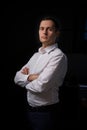 Closeup portrait of a young man, happy, cheerful, handsome businessman is standing in modern office in white shirt Royalty Free Stock Photo