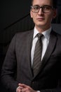 Closeup portrait of a young man, happy, cheerful, handsome businessman is standing in modern office in white shirt Royalty Free Stock Photo