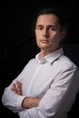 Closeup portrait of a young man, happy, cheerful, handsome businessman is standing in modern office in white shirt Royalty Free Stock Photo