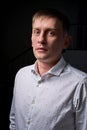 Closeup portrait of a young man, happy, cheerful, handsome businessman is standing in modern office in white shirt Royalty Free Stock Photo