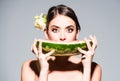Closeup portrait of young sensual hispanic or italian woman eating watermelon isolated on gray background. Royalty Free Stock Photo