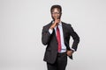 Closeup portrait young serious african businessman placing finger on lips saying, shhh, be quiet, silence, isolated grey backgroun Royalty Free Stock Photo