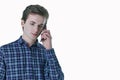 Closeup portrait of young, serious business man, corporate employee, student talking on cell phone. Royalty Free Stock Photo