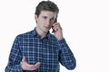 Closeup portrait of young, serious business man, corporate employee, student talking on cell phone. Royalty Free Stock Photo