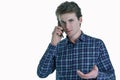 Closeup portrait of young serious business man, corporate employee, student talking on cell phone. Royalty Free Stock Photo