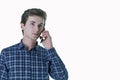 Closeup portrait of young, serious business man, corporate employee, student talking on cell phone. Royalty Free Stock Photo