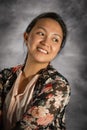 A closeup portrait of a young smiling Filipina girl.