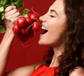 Closeup portrait of young sport woman eating fresh radish green