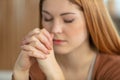 closeup portrait young woman praying Royalty Free Stock Photo