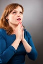 Closeup portrait of a young woman praying Royalty Free Stock Photo