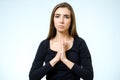 Closeup portrait of a young woman praying Royalty Free Stock Photo