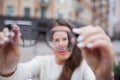 Closeup portrait of young women with glasses. She has eyesight problems and is squinting his eyes a little bit. Beautiful girl is Royalty Free Stock Photo