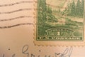 Closeup of postcard wavy cancellation postmark lines over Yosemite stamp