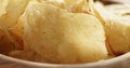 Closeup of potato chips with herbs in wood bowl Royalty Free Stock Photo