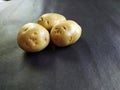 Closeup of potatoes, black background. Royalty Free Stock Photo