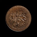 Closeup of a 1 pound coin from 2000 isolated on a black background, British national currency