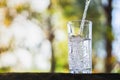Closeup Pouring fresh water on drinking glass Royalty Free Stock Photo
