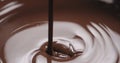 Closeup pouring molten dark chocolate