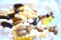 Closeup macro view of all sorts mixed organic vitamin supplements pills, tablets and capsules Royalty Free Stock Photo