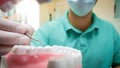 Closeup POV image of dentist using special dental instruments for inspecting teeth