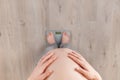 Pregnant woman standing on scales Royalty Free Stock Photo