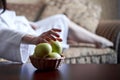 Closeup pregnant woman belly in white bathrobe