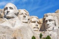 Closeup of presidential sculpture at Mount Rushmore national memorial, USA. Blue sky background. Royalty Free Stock Photo