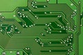 Closeup printed circuit board green for background, there are a lot of conductive tracks