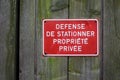 private property panel in french defense de stationner propriete privee on wooden door traduction in english no