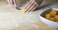 Closeup process making ravioli vegan homemade pasta. Housewife cook closes with a fork `tortelli di zucca`, traditional italian