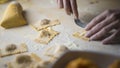 Closeup process making ravioli vegan homemade pasta. Housewife cook closes with a fork `tortelli di zucca`, traditional italian