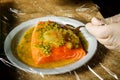 closeup process of marinating raw salmon fillet